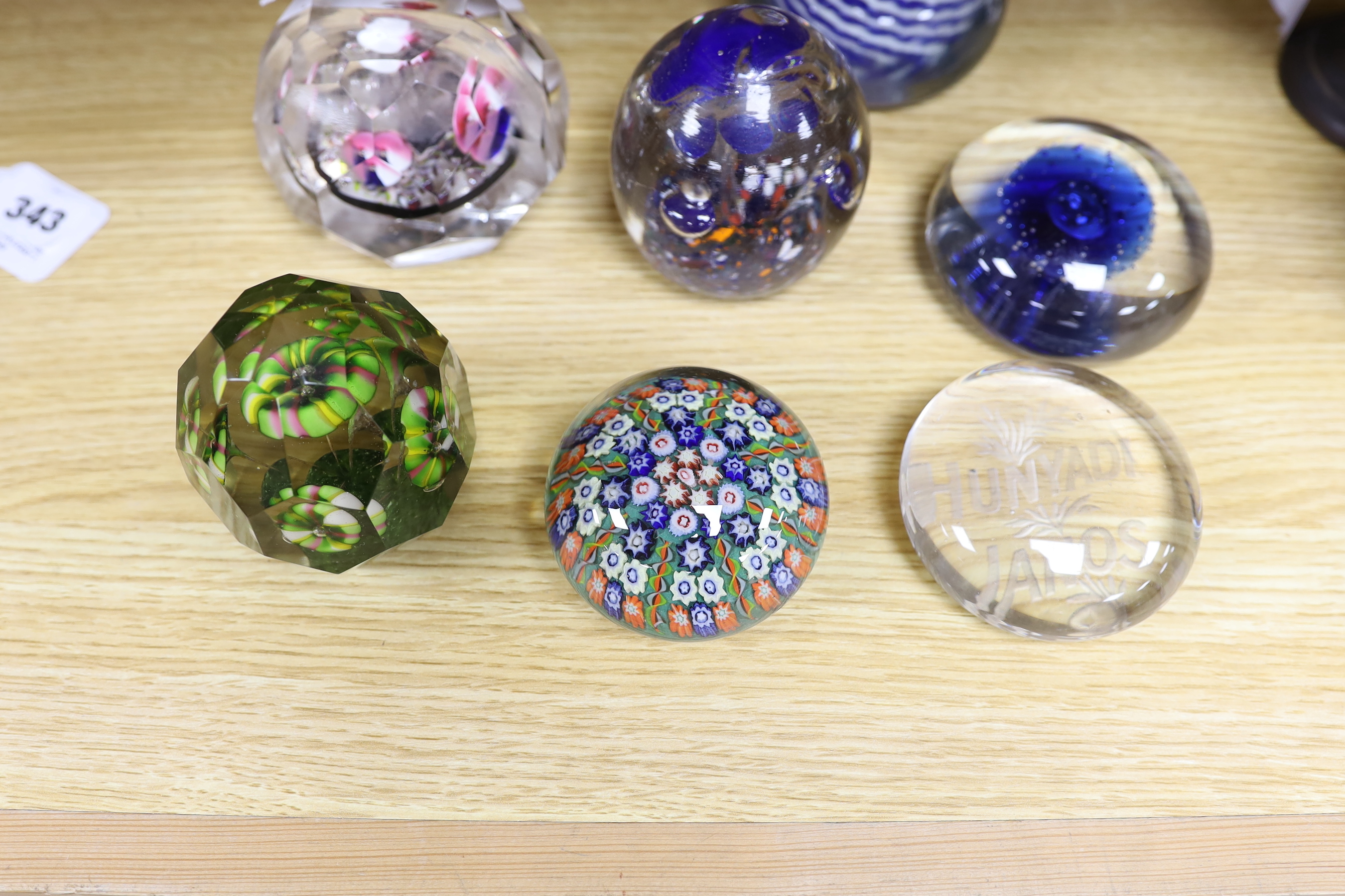 Nine various Bohemian or Hungarian glass paperweights, including for early 20th century Bohemian faceted glass paperweights
